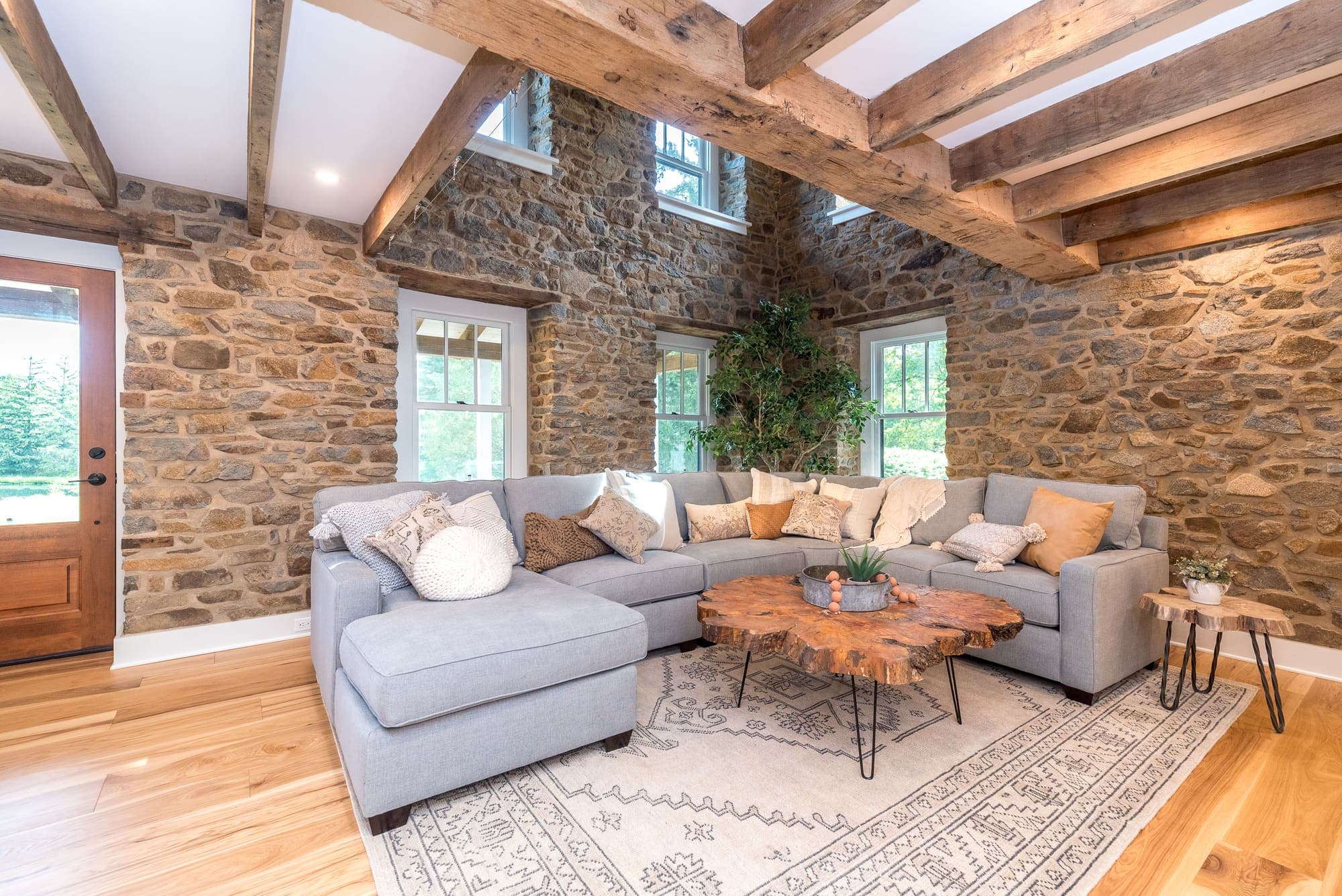 Great Room with fieldstone walls and exposed beams